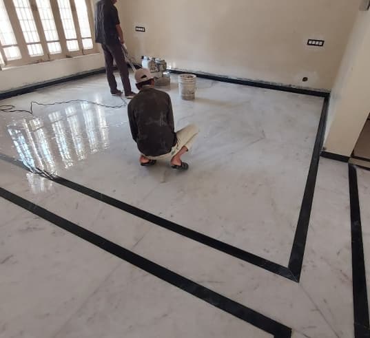 Tile installation and finishing work using tile adhesive.