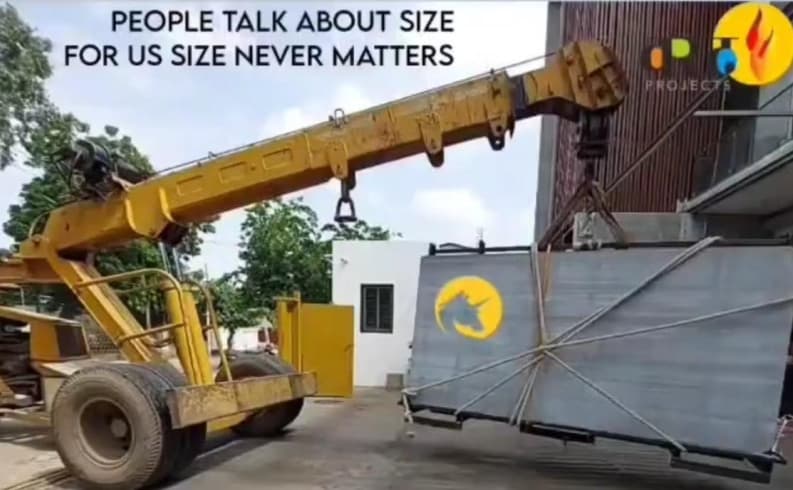 Large-format construction material movement at site.